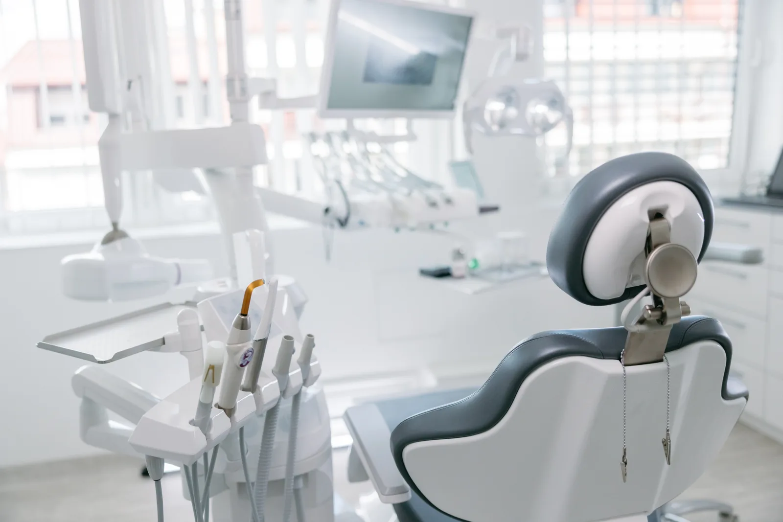 Dental operatory with treatment chair and instrument console in soft daylight